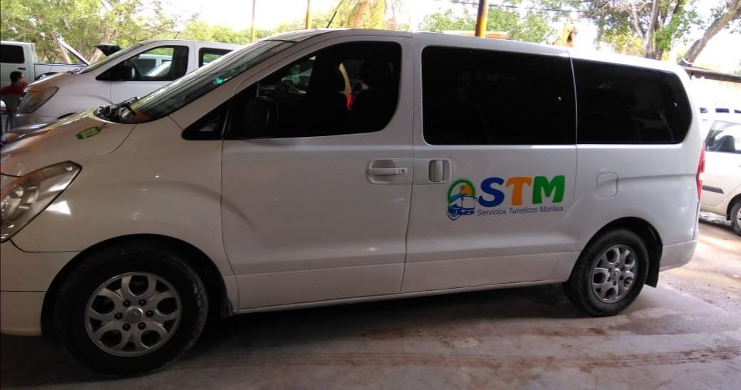 a van parked in front of a car